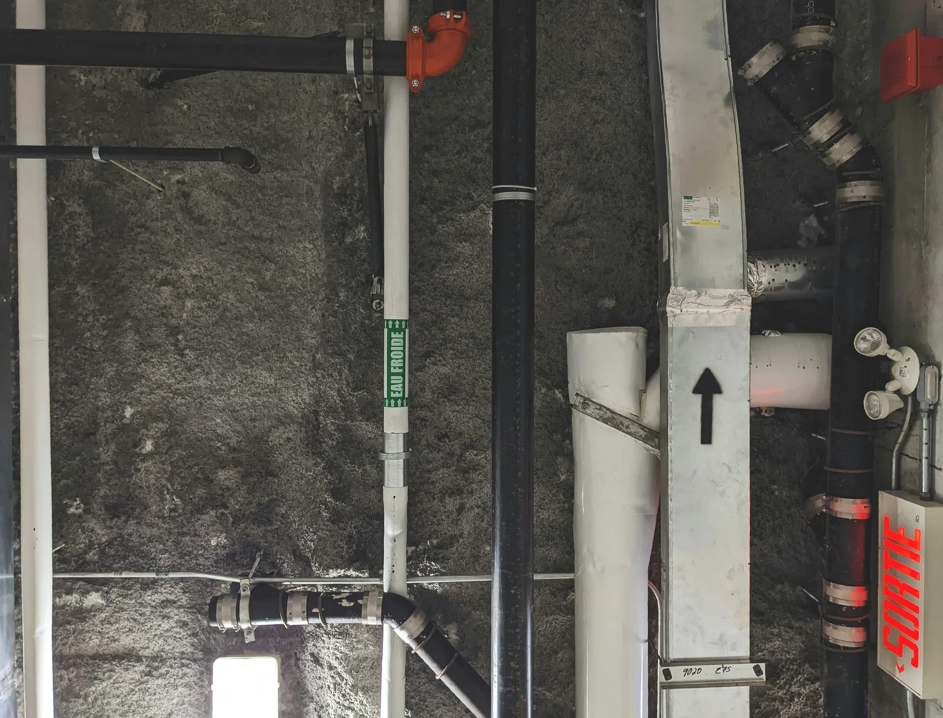 A diagram showing a leaking pipe abandoned under the slab, with a new pipe route going up a wall and across the ceiling.