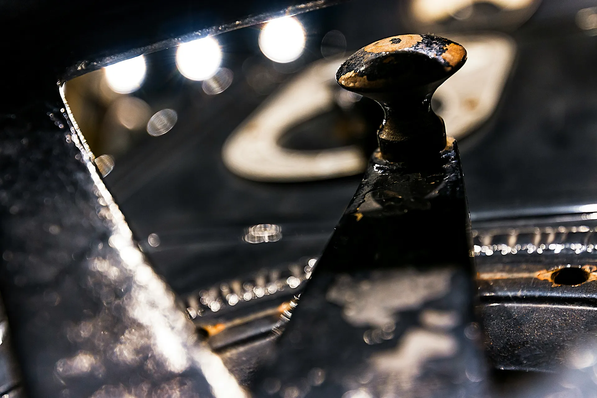 A sump pump sitting in a sump pit in a clean basement, ready for inspection.